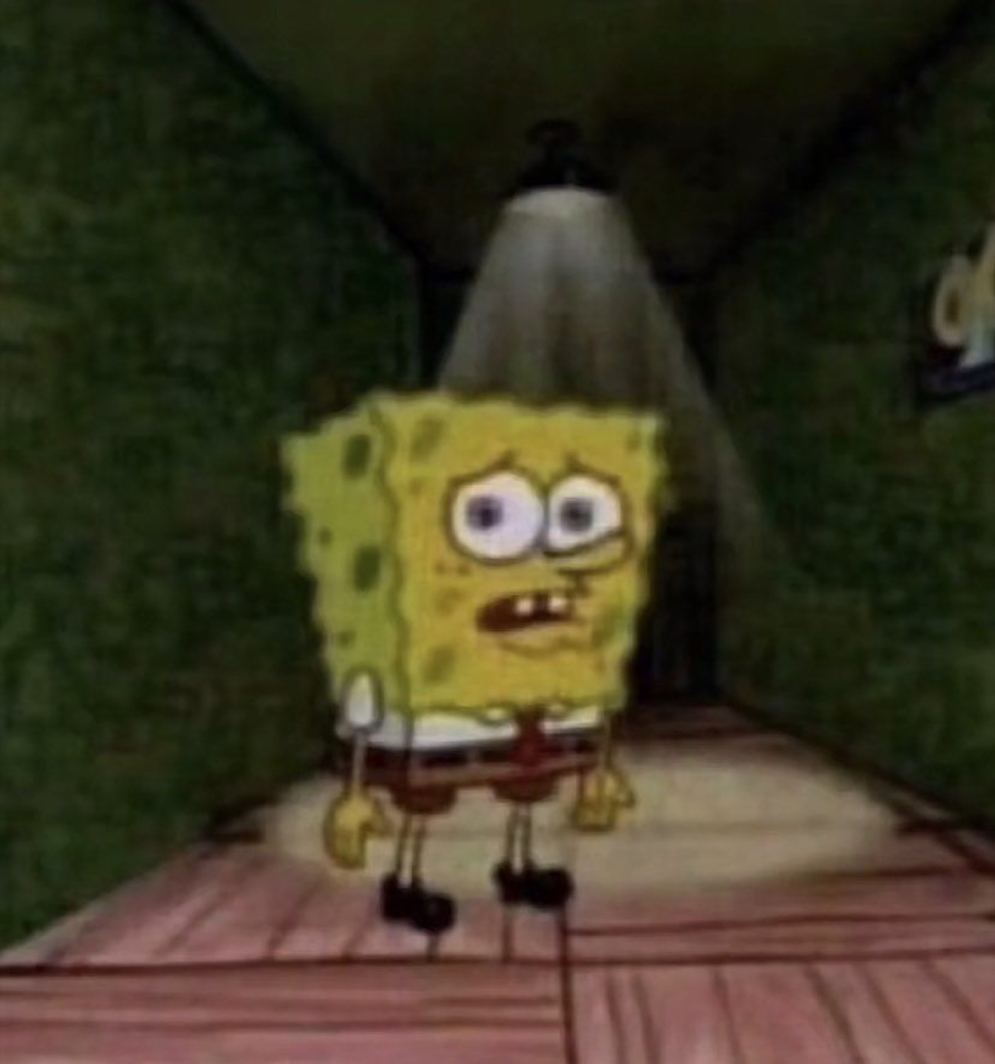SpongeBob standing alone under a spotlight looking extremely nervous