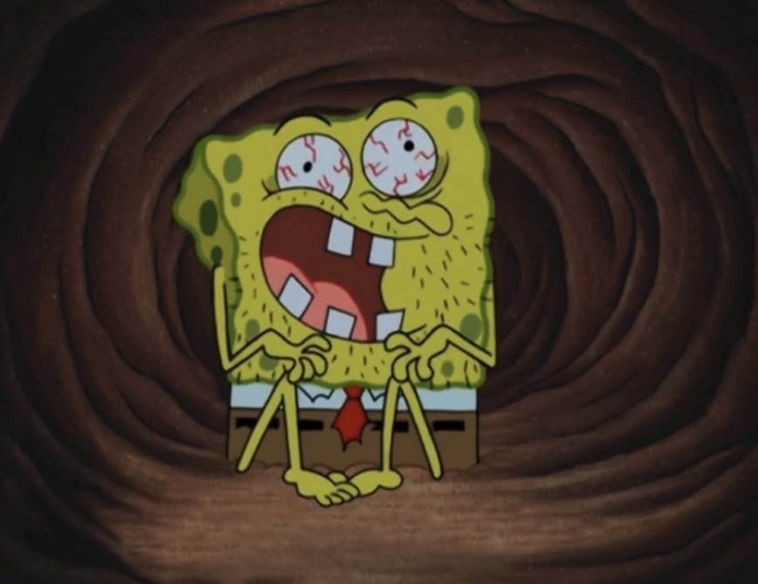 SpongeBob in a swirling vortex with bulging bloodshot eyes and a wide horrified mouth