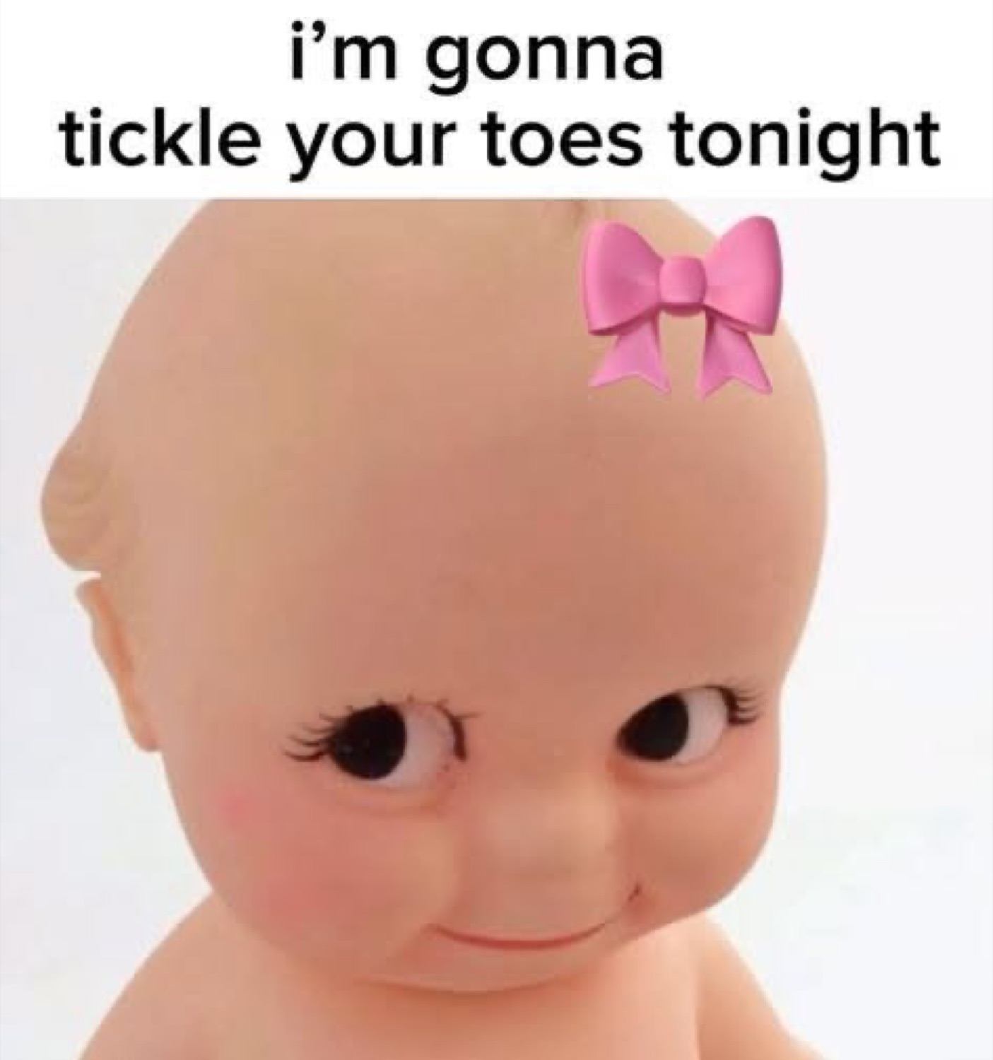 Kewpie baby doll with a pink bow smirking, captioned 'i'm gonna tickle your toes tonight'