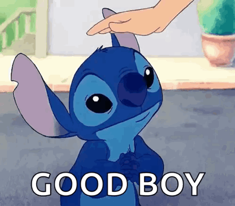 Hand patting Stitch on the head, "Good boy"