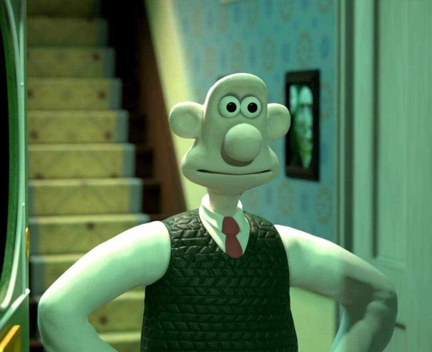 Wallace from Wallace and Gromit standing hands-on-hips with a mild, satisfied grin