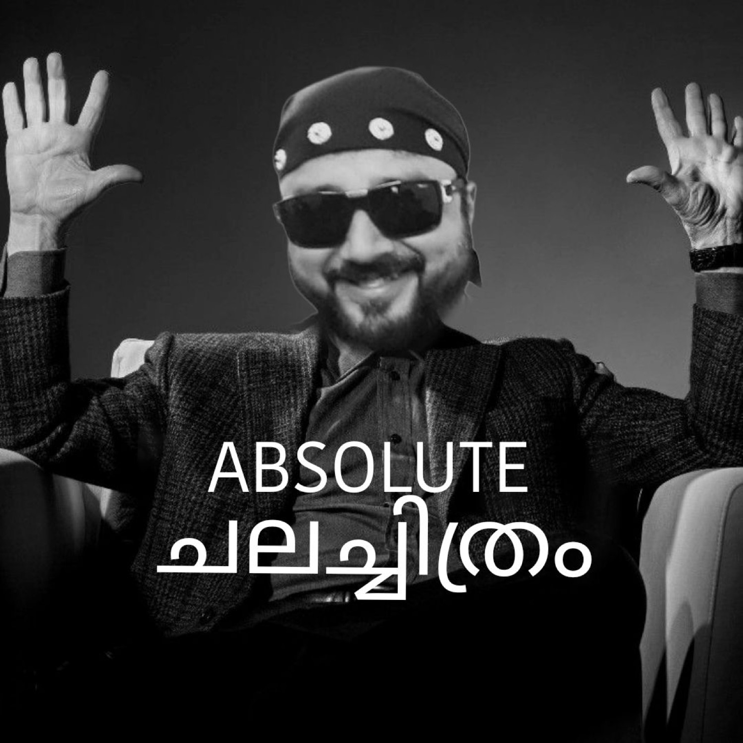 Man in a bandana with hands raised: 'ABSOLUTE ചലച്ചിത്രം' (absolute cinema)
