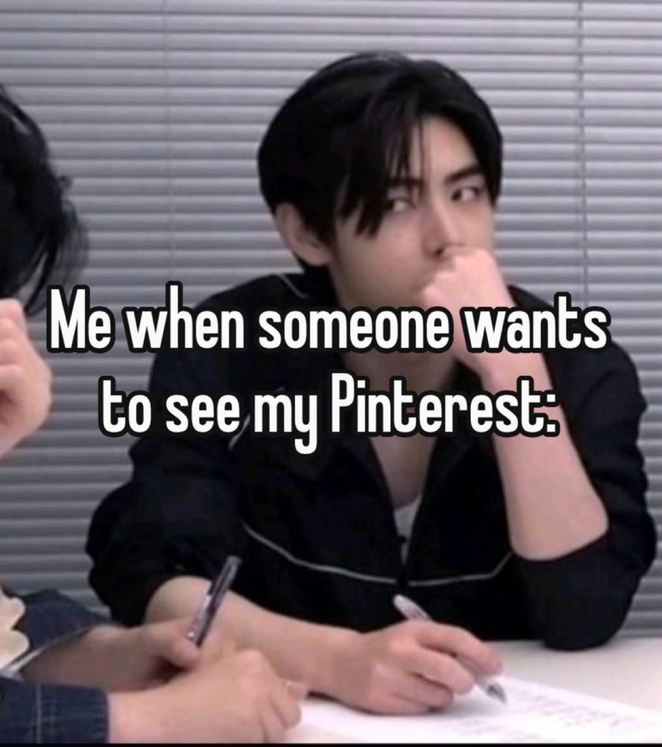 Young man resting chin on fist with a cautious, guarded look; text references showing their Pinterest