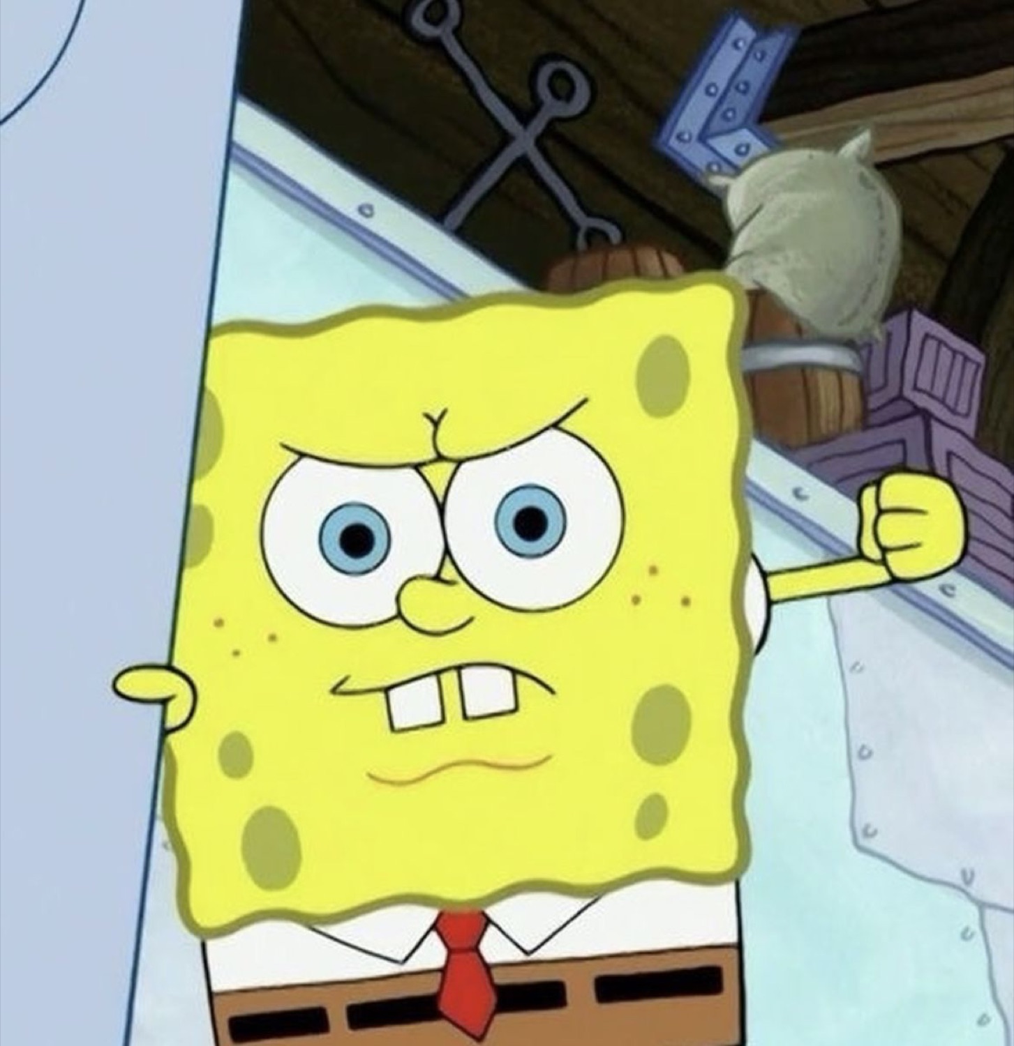 SpongeBob gritting his teeth with a raised fist, fuming with rage