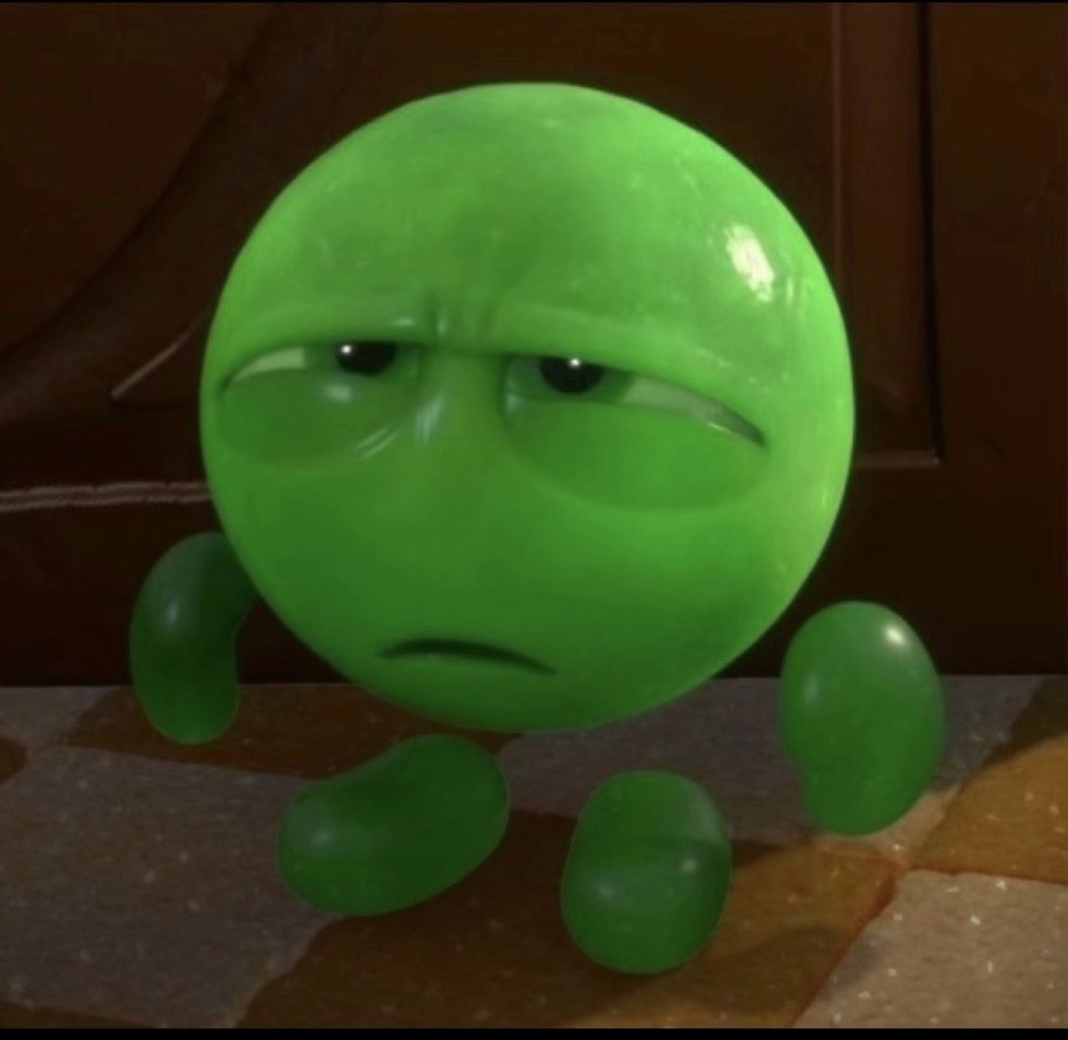 Round green cartoon blob with droopy eyes and a deeply unimpressed frown
