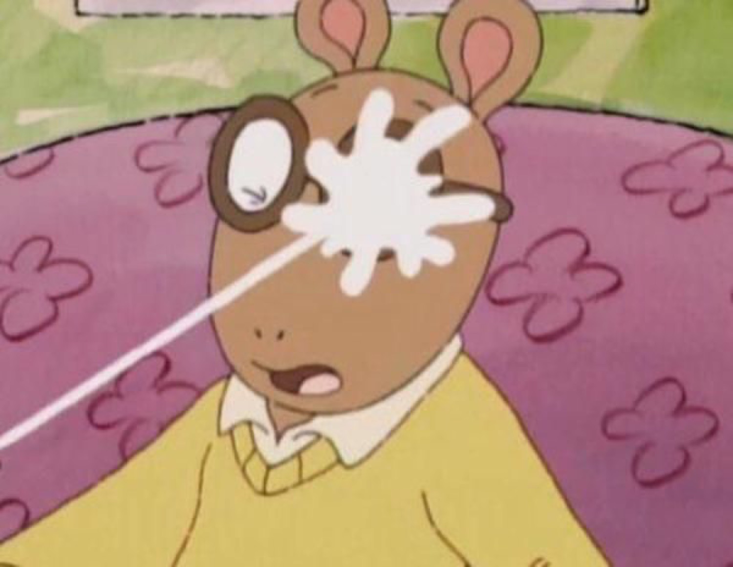Cartoon aardvark hit in the face by a splash, eye wide and mouth open in shock