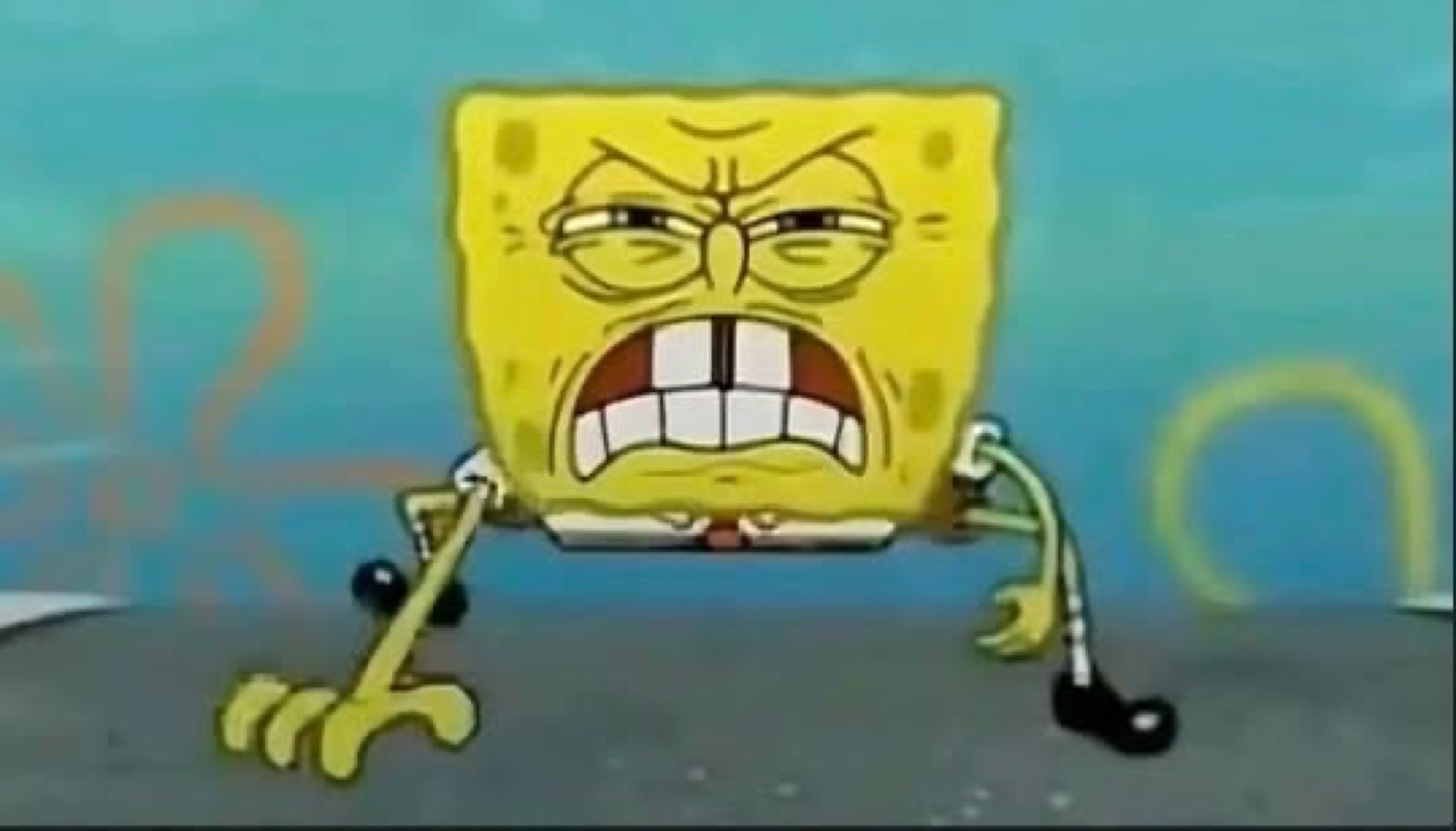 SpongeBob gritting his teeth in rage, crouched on the ground