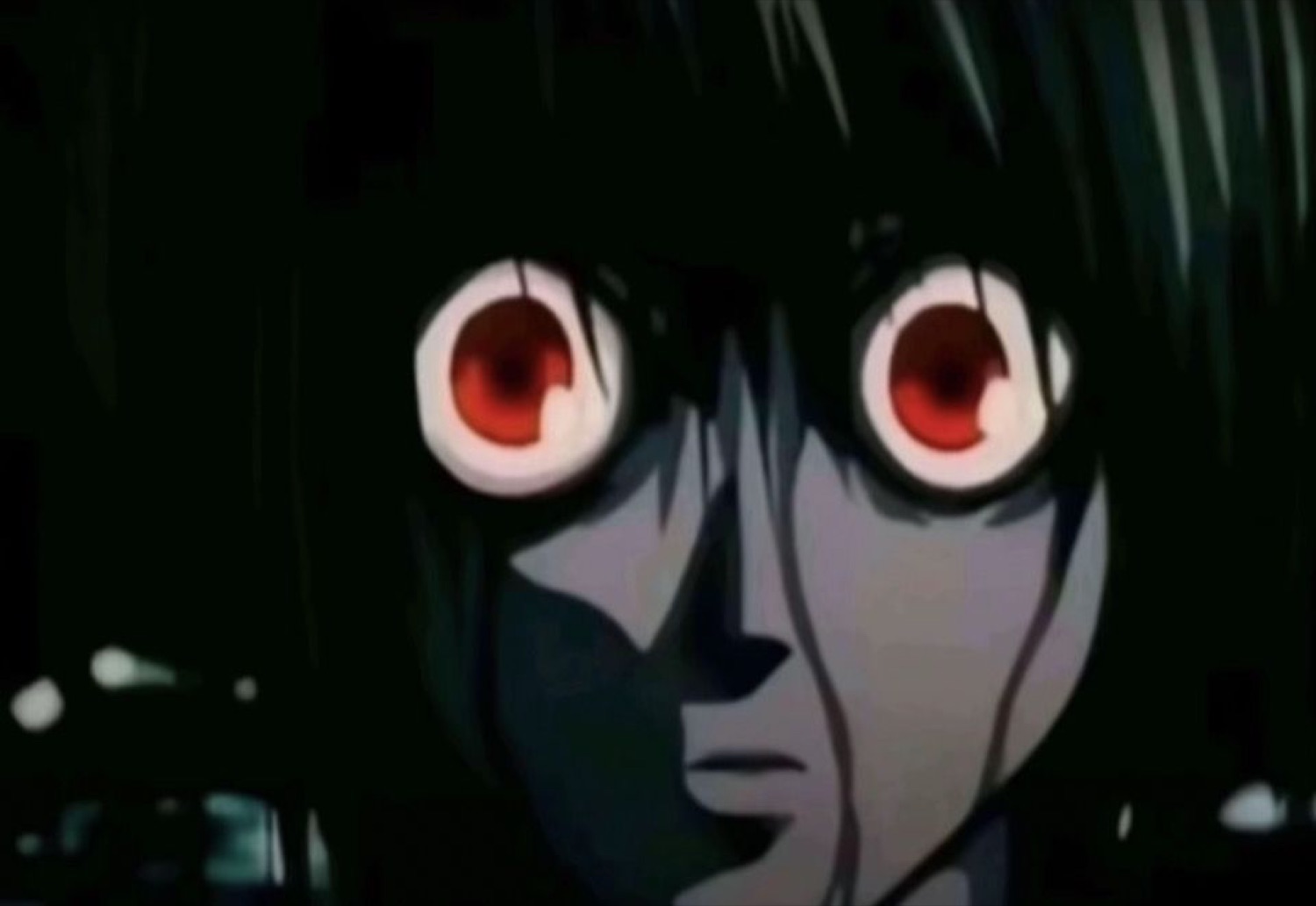 Anime character with glowing red eyes staring in wide-eyed shock in the dark