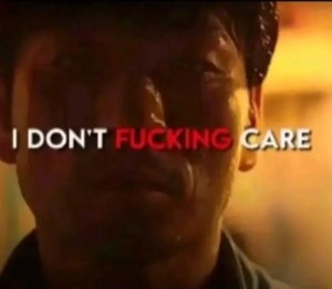 Man looking exhausted and defeated with text 'I DON'T FUCKING CARE' across his face