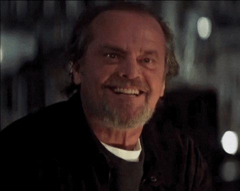 Jack Nicholson grinning and slowly nodding