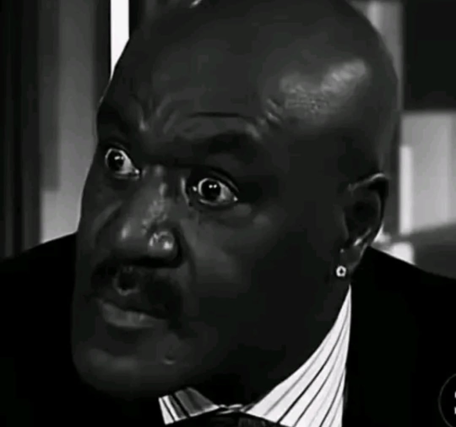 Shaq staring directly into the camera with wide eyes that say he did not expect that at all