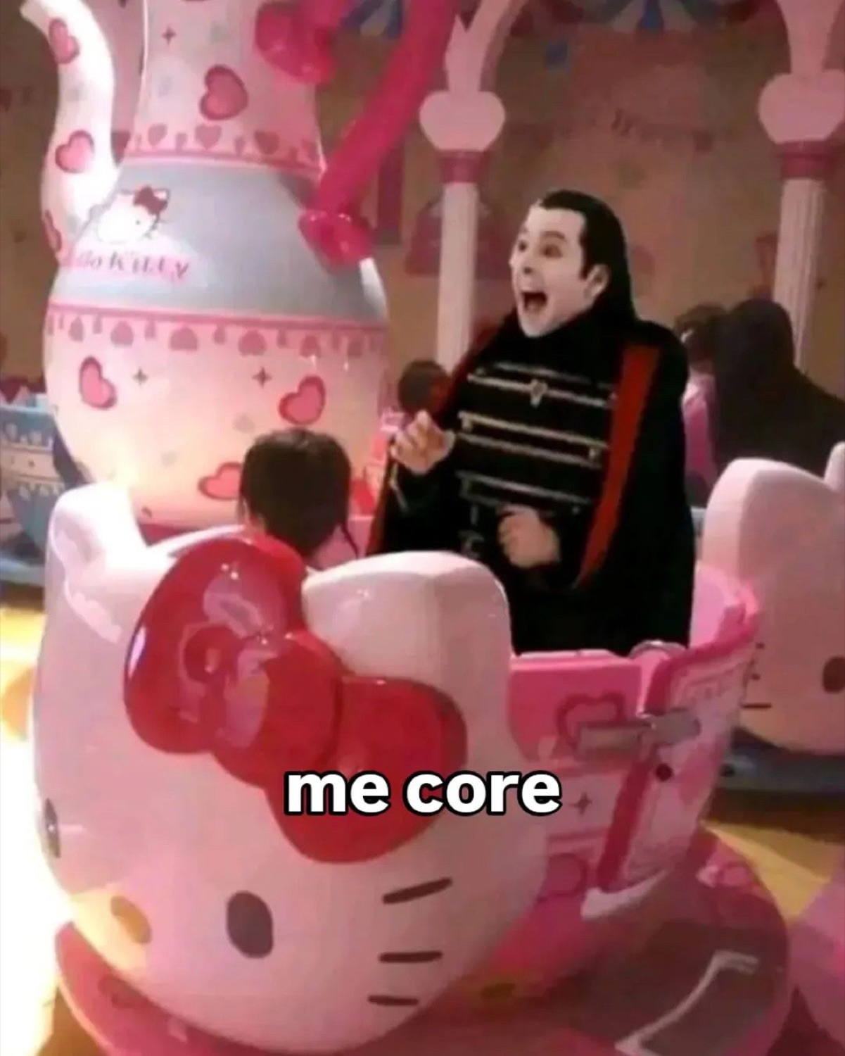 Dracula riding a Hello Kitty teacup ride: 'me core'