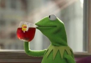 Kermit the Frog sipping Lipton tea by a window, completely unbothered and minding his business