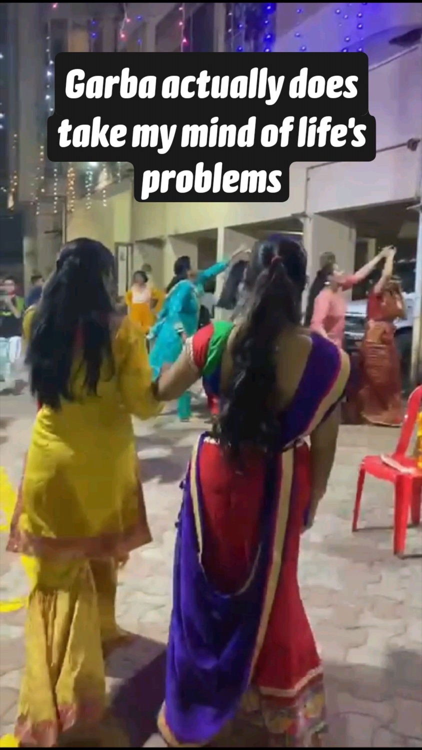 Women dancing at night: 'Garba actually does take my mind of life's problems'