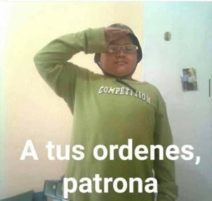 Chubby kid in a green hoodie giving a forehead salute, captioned 'A tus ordenes, patrona'