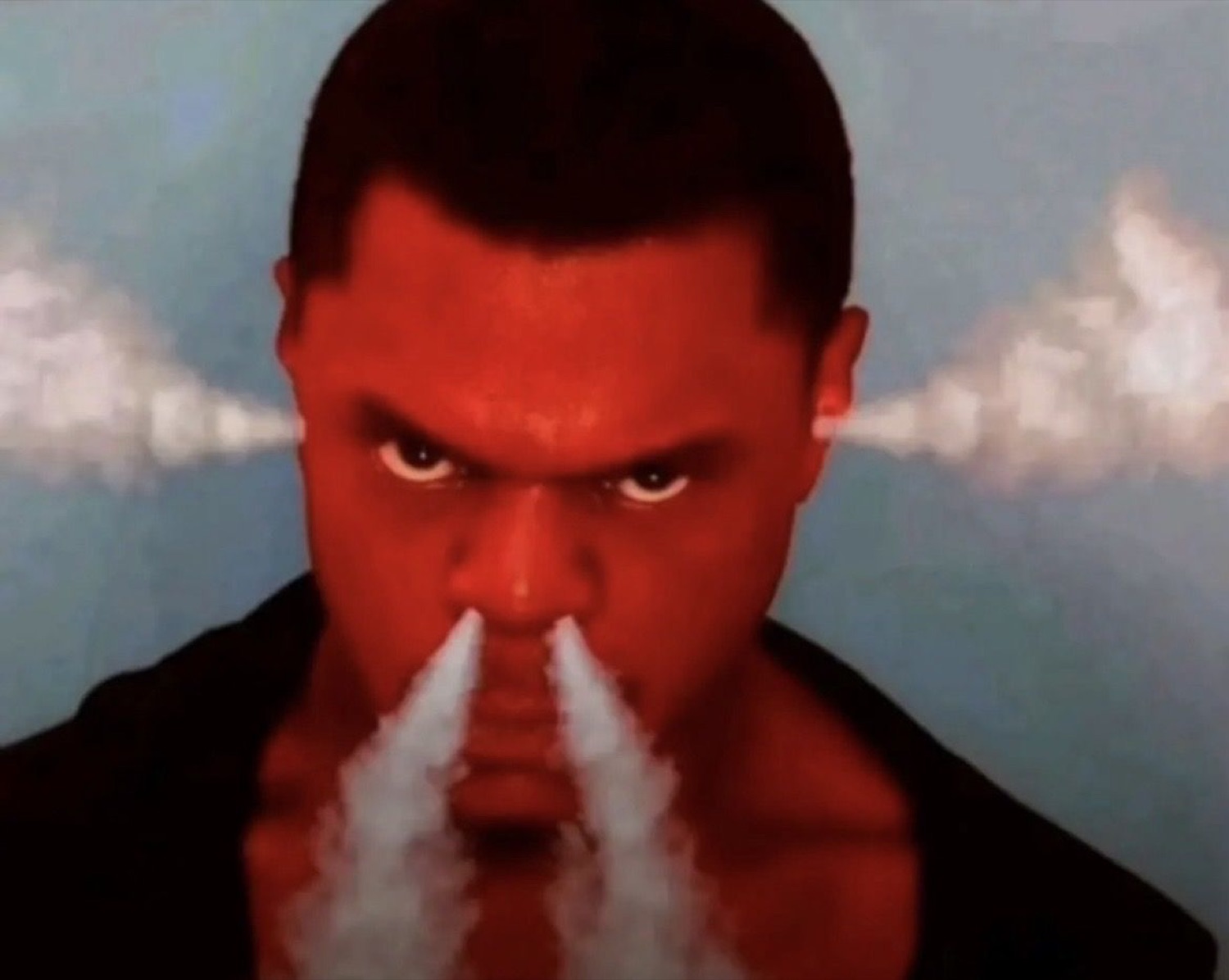 Man lit in red with steam shooting from his nostrils and a furious, seething glare