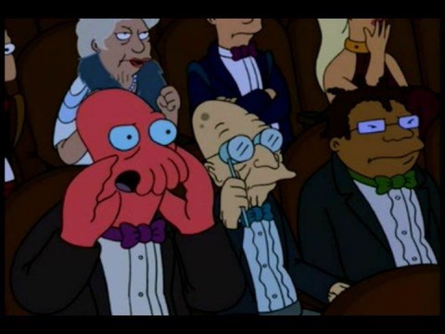 Zoidberg gasping with his claws over his face at something scandalous in the audience