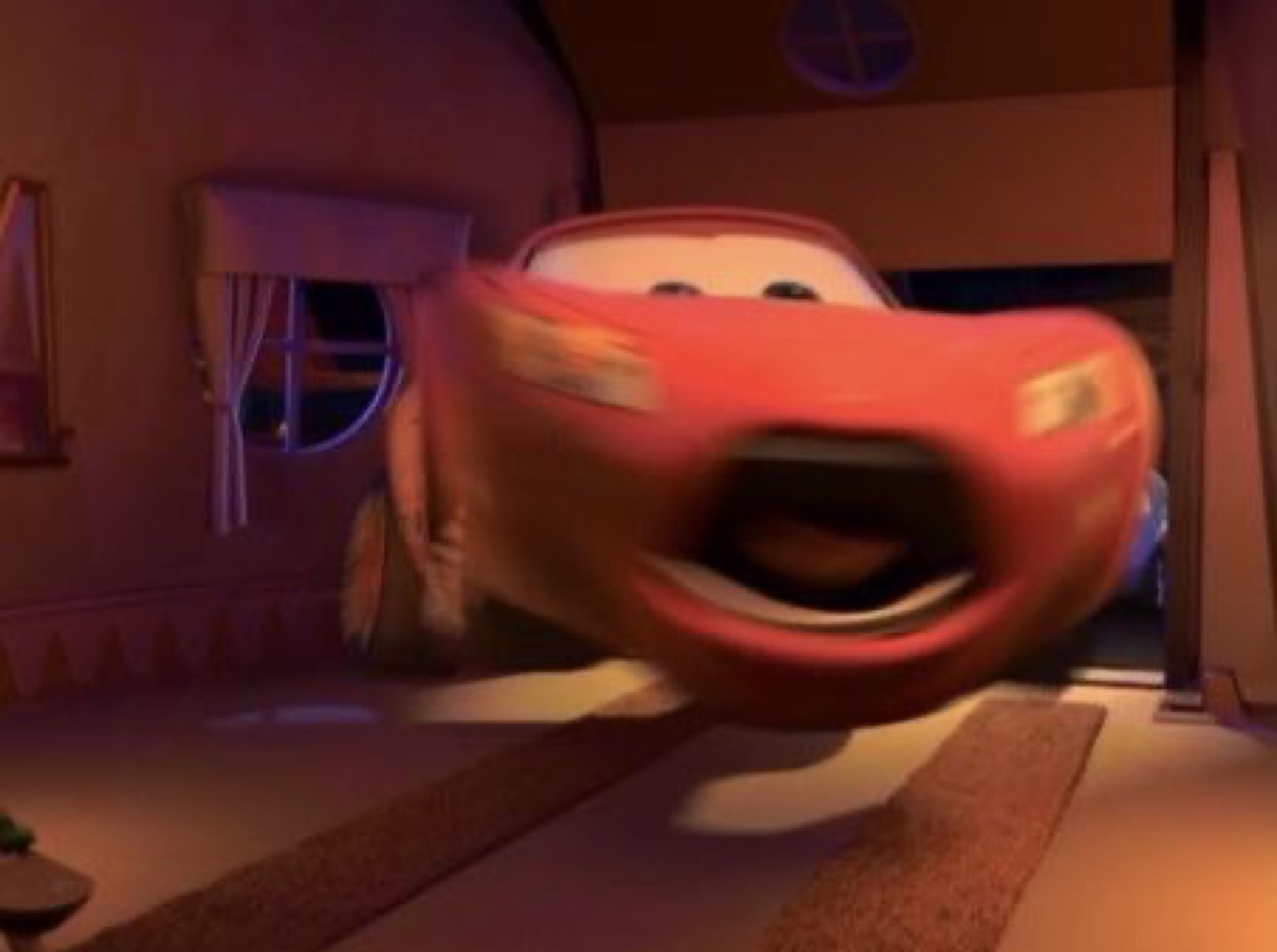 Lightning McQueen screaming mid-air in a garage