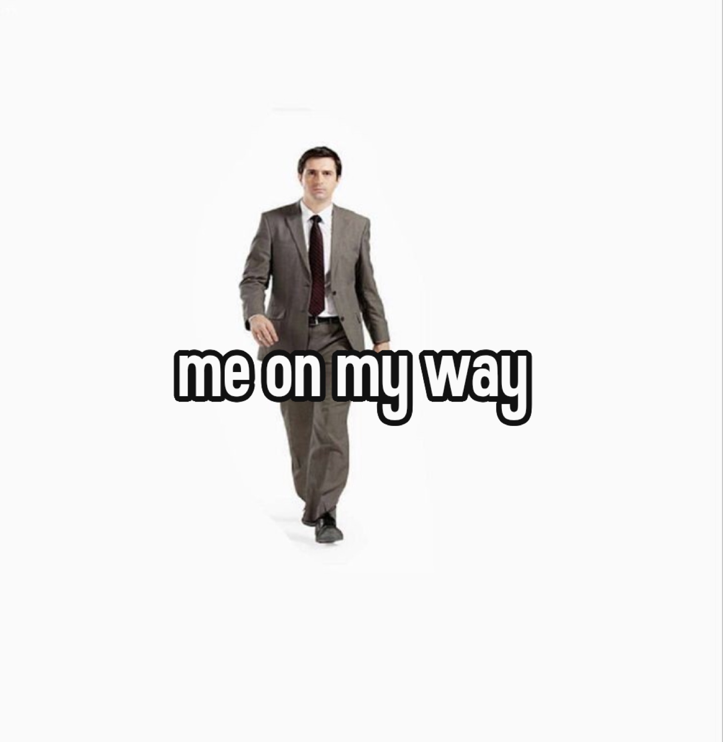 Man in a suit walking toward the camera: 'me on my way'