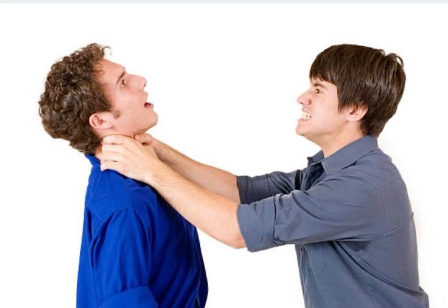 One guy grabs another by the throat on a white background in a staged confrontation