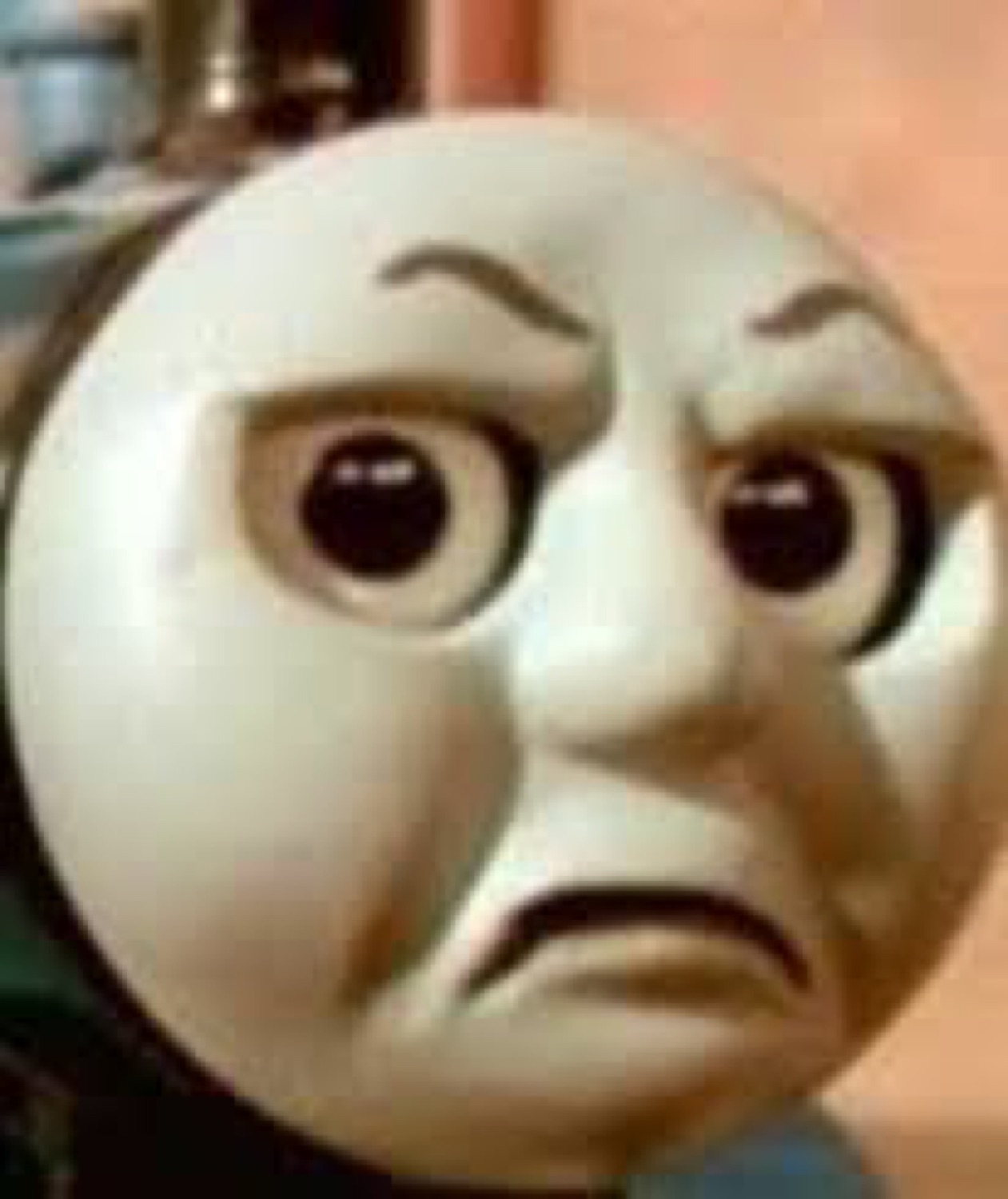 Thomas the Tank Engine scrunching his face into an annoyed, disgruntled frown