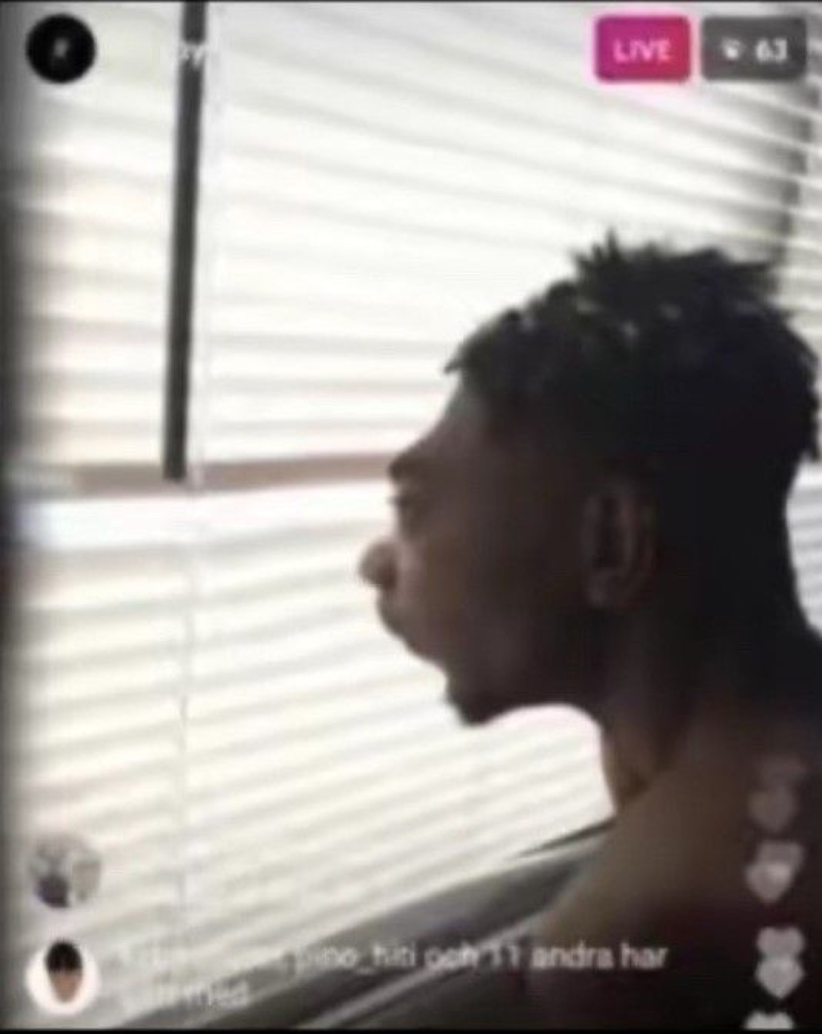 Man on an Instagram Live turned in profile, mouth open mid-shout
