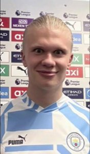 Erling Haaland in a Man City interview flashing a wide, goofy tight-lipped grin