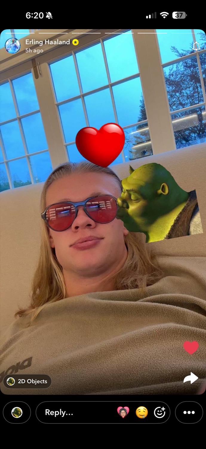 Erling Haaland lounging in sunglasses on a Snapchat story with a Shrek sticker kissing his cheek
