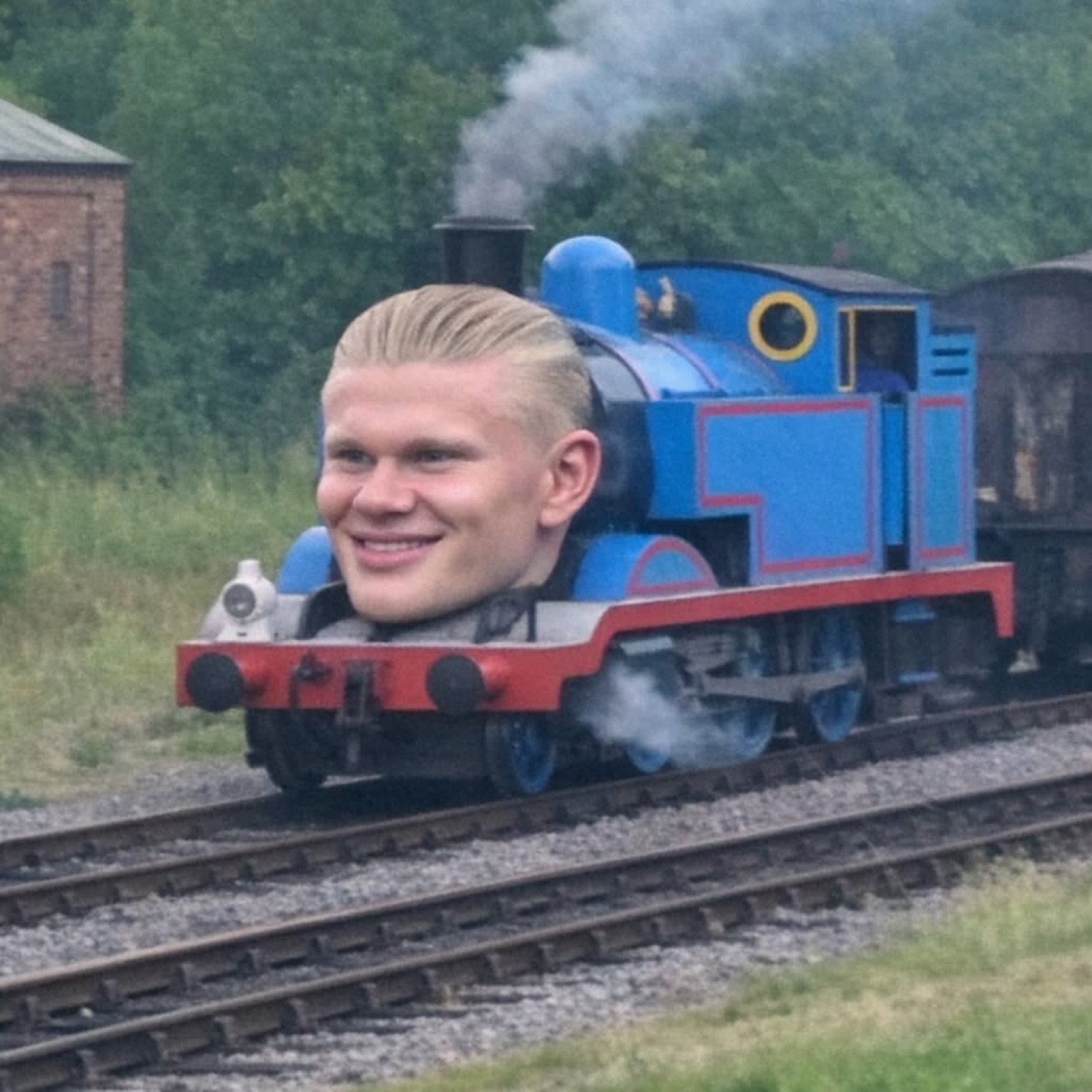 Erling Haaland's grinning face photoshopped onto Thomas the Tank Engine barreling down the tracks