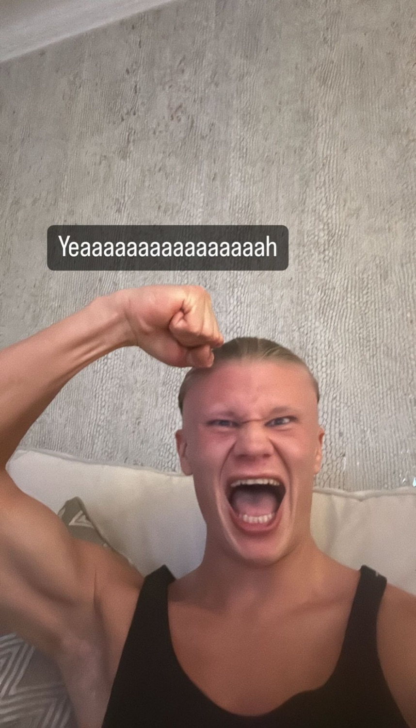Man flexing his bicep and screaming in triumph captioned 'Yeaaaaaaah'