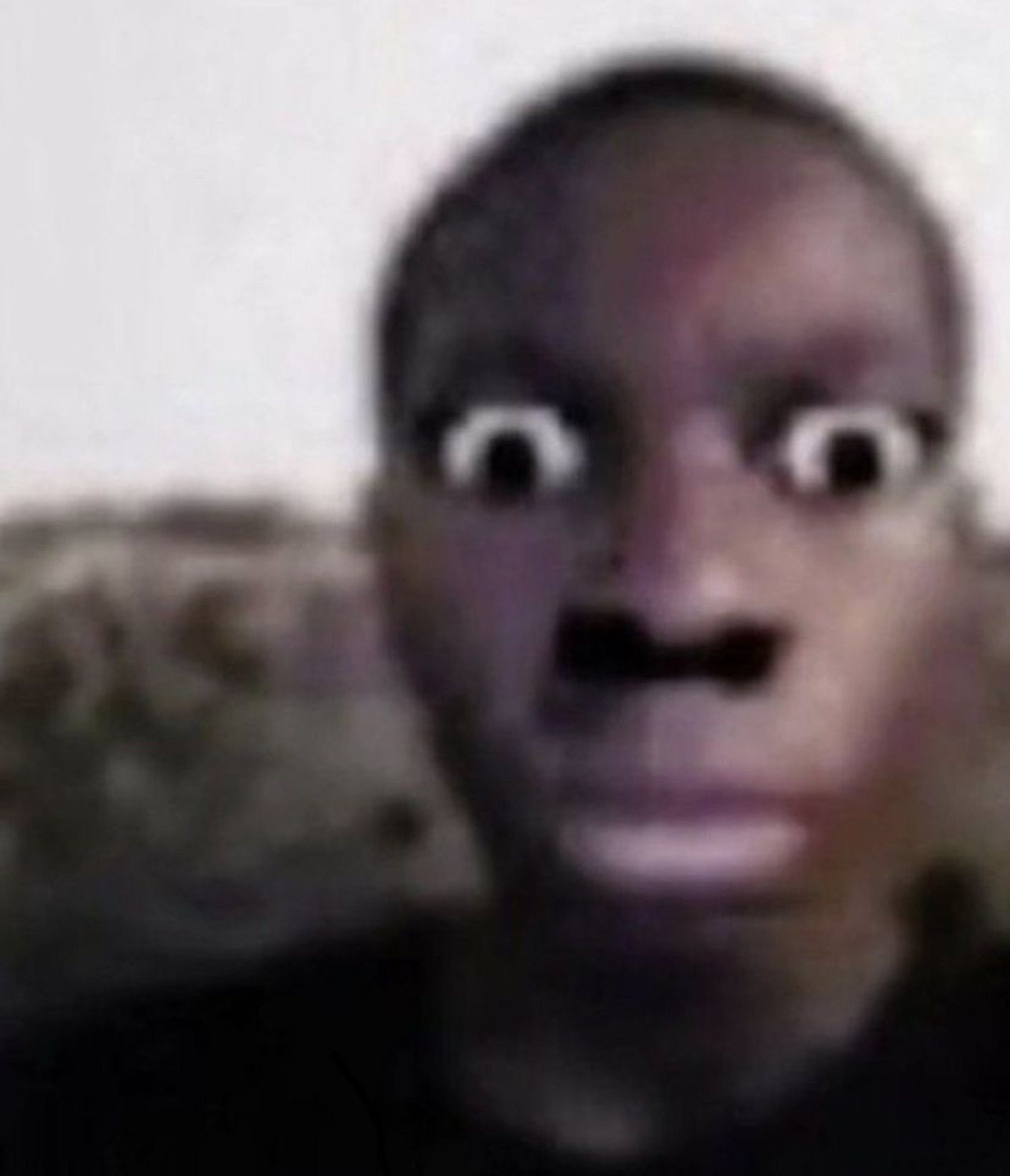 Blurry face with wide shocked eyes