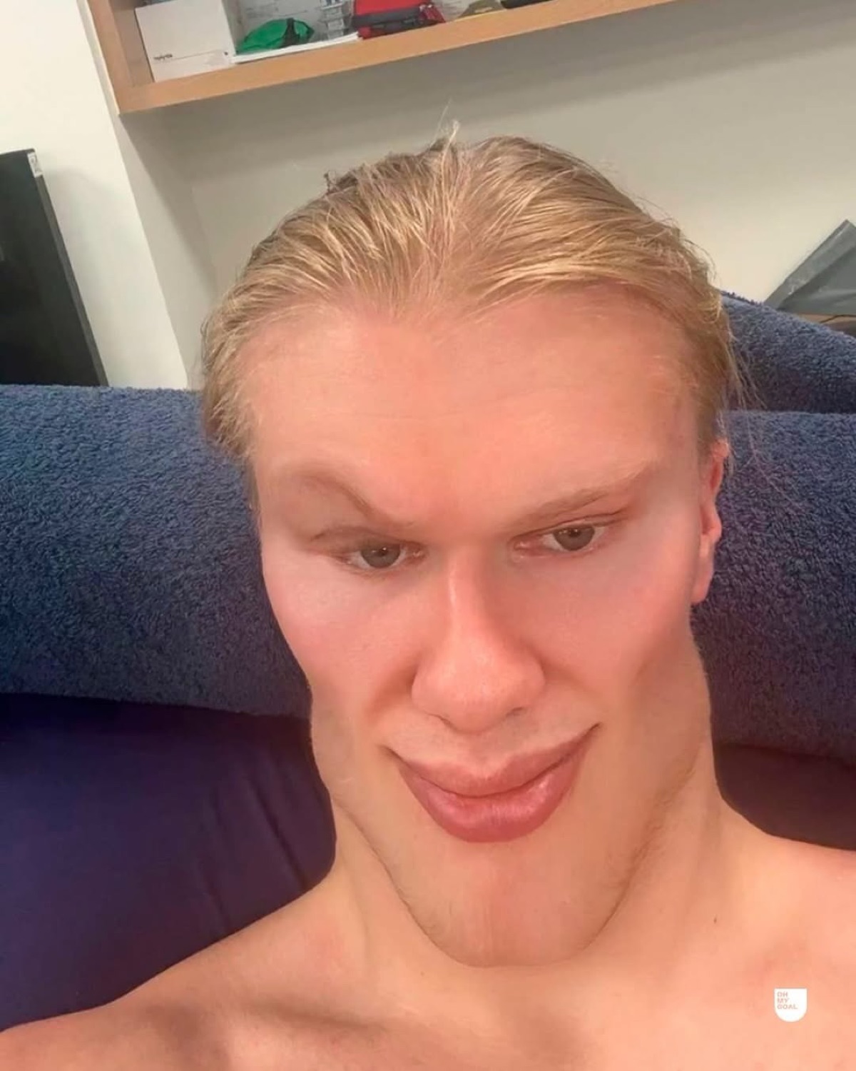 Erling Haaland selfie sprawled on a couch with slicked-back hair and a smug deadpan stare