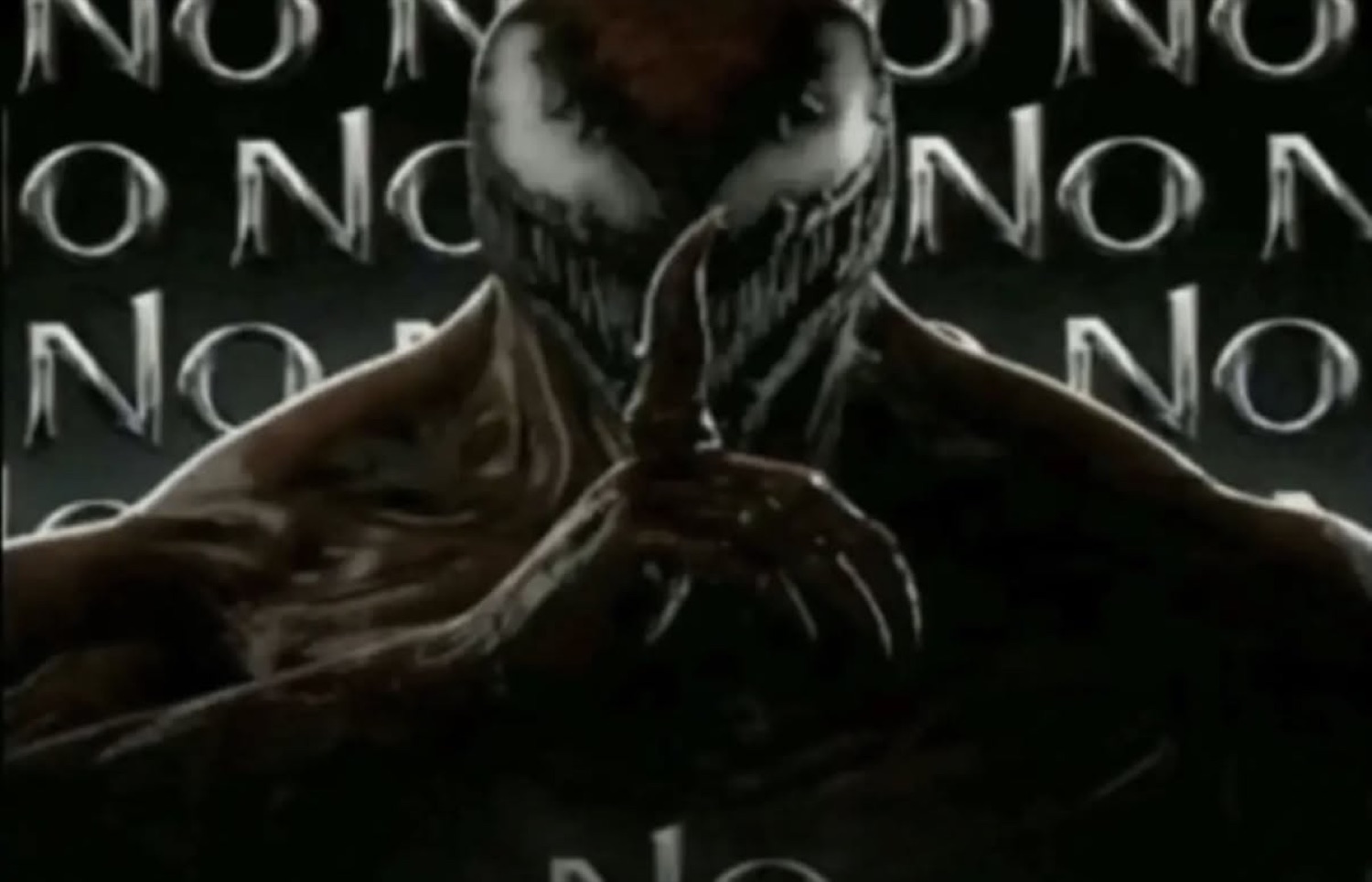 Venom grinning in the dark surrounded by 'NO NO NO'