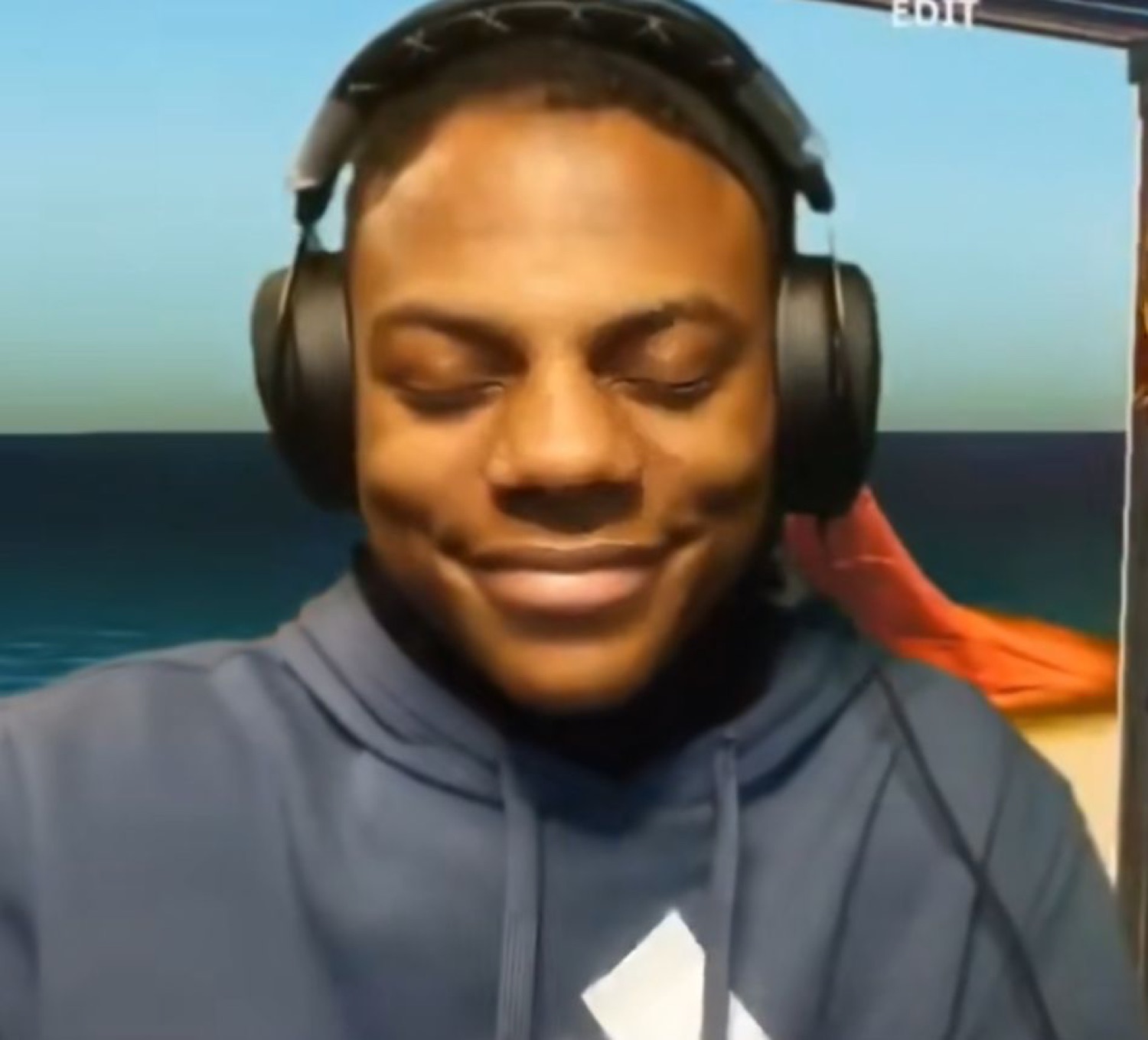Guy wearing headphones, eyes closed, smiling serenely like he's heard enough