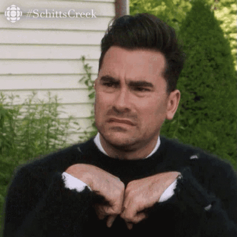 Dan Levy as David Rose in Schitt's Creek recoiling in disgust