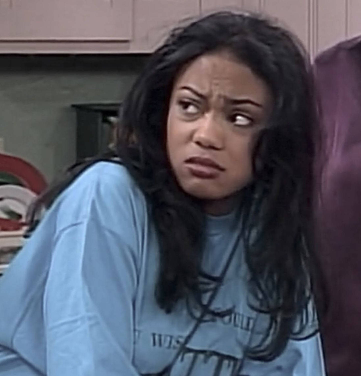 Young woman recoiling with a disgusted side-eye grimace