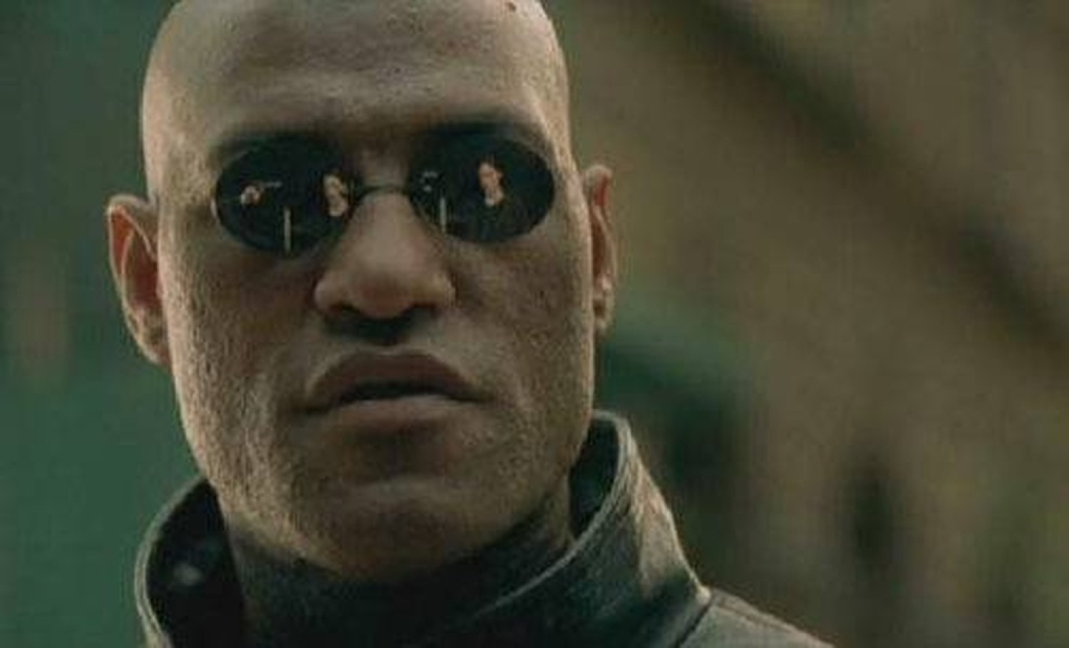 Morpheus in his mirrored shades giving a skeptical, sizing-you-up look