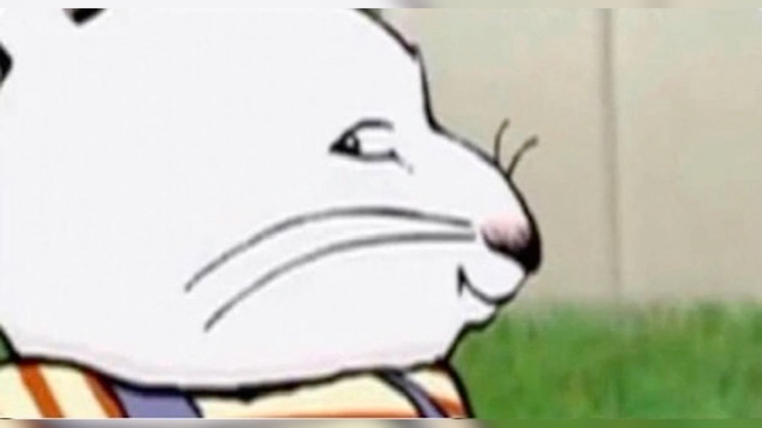Extreme close-up of a cartoon rabbit's face with a sly, side-glancing smirk