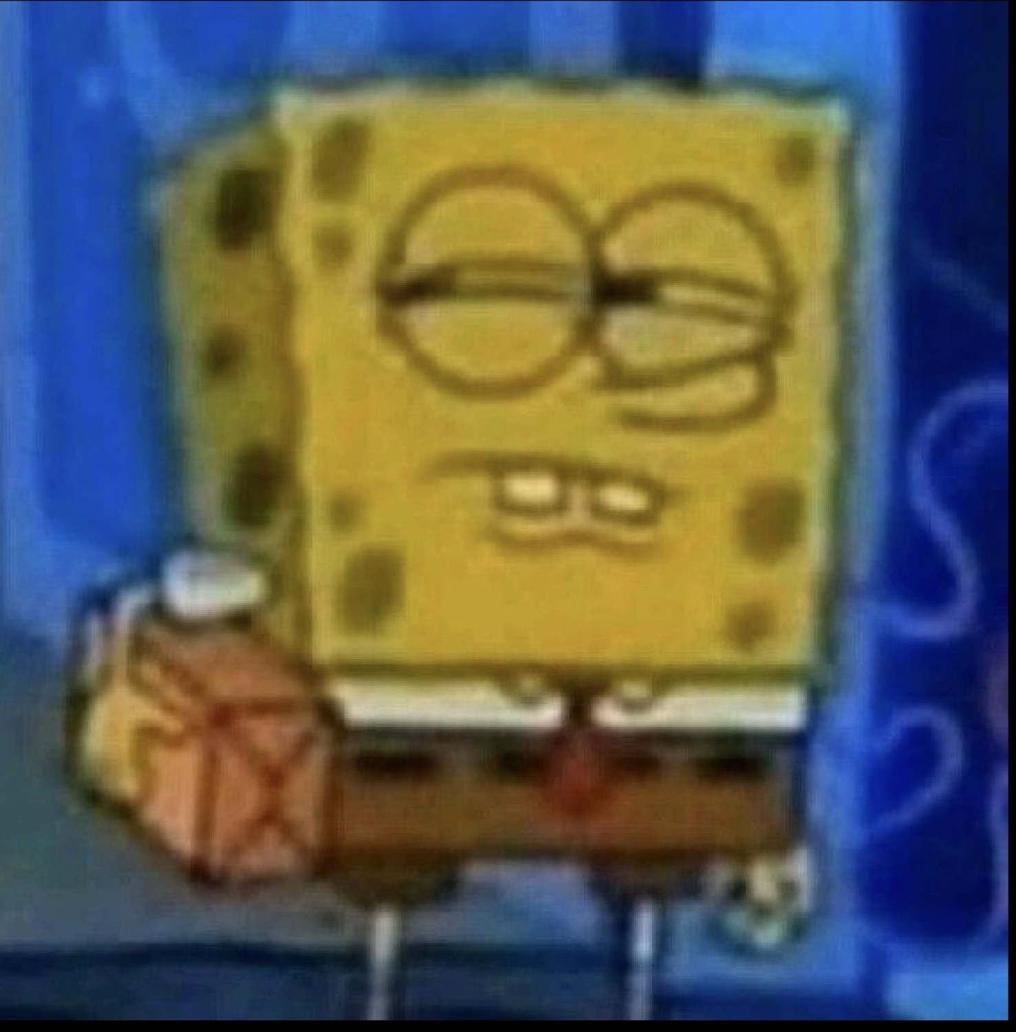 SpongeBob giving a half-lidded smug glare with his fist raised