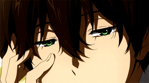Green-eyed anime boy resting a hand near his mouth with a coy, uneasy look