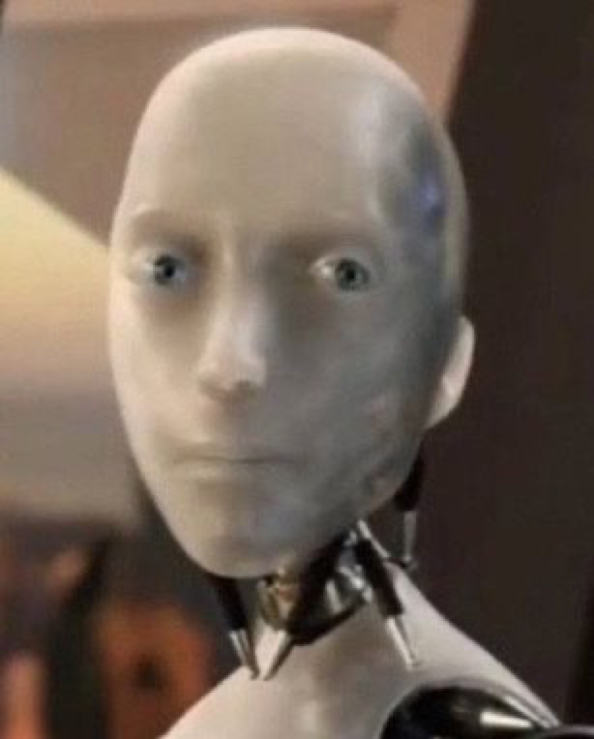 The I, Robot android staring blankly with a slightly puzzled, hollow expression