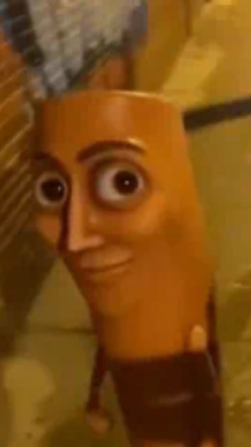 Weird animated pharaoh or museum figure staring with unsettling wide eyes and a grin