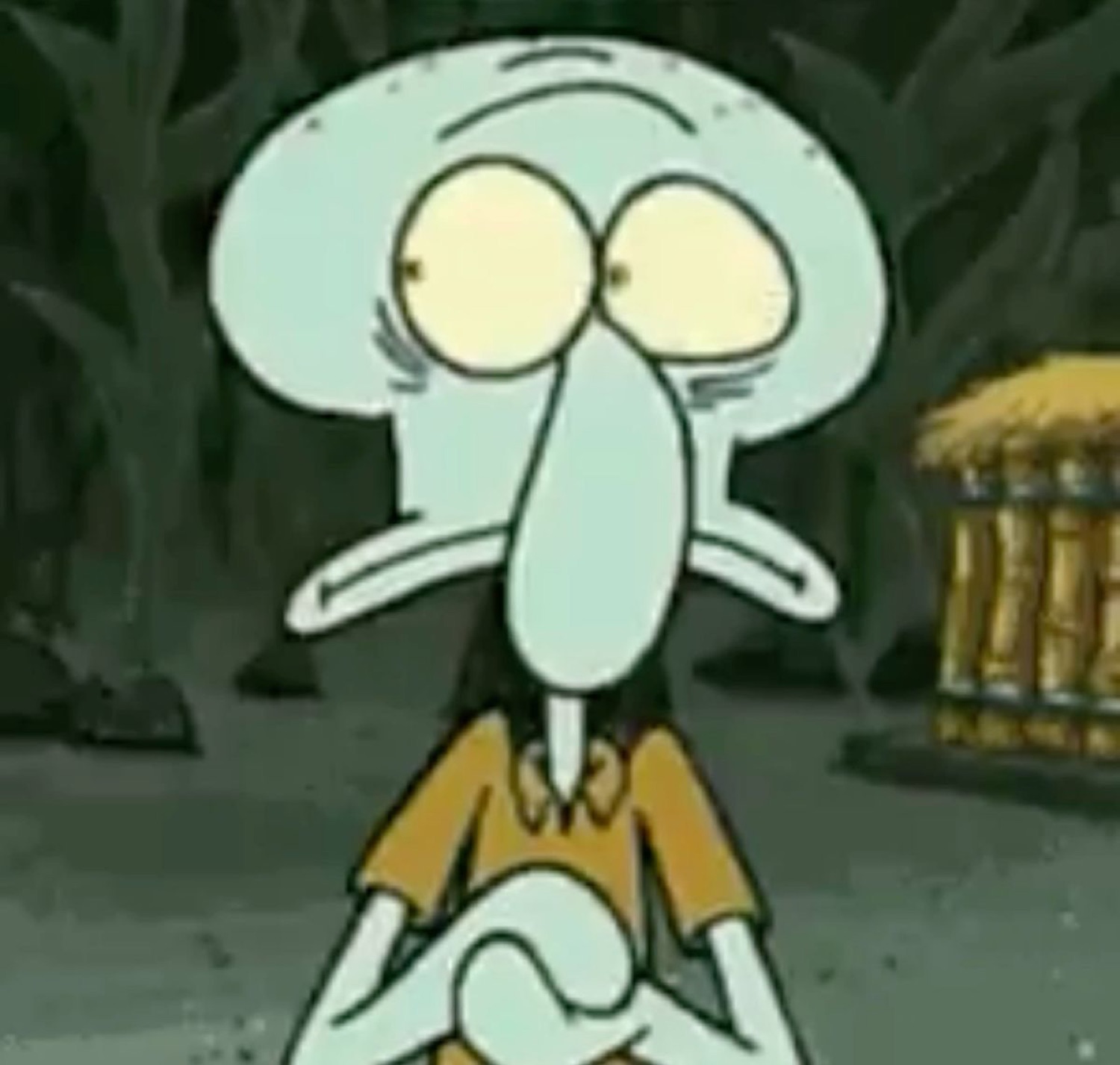Squidward sitting with a flat, tired, dead-inside stare