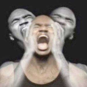 Man screaming with his hands on his head, face smeared into a motion-blur triple exposure