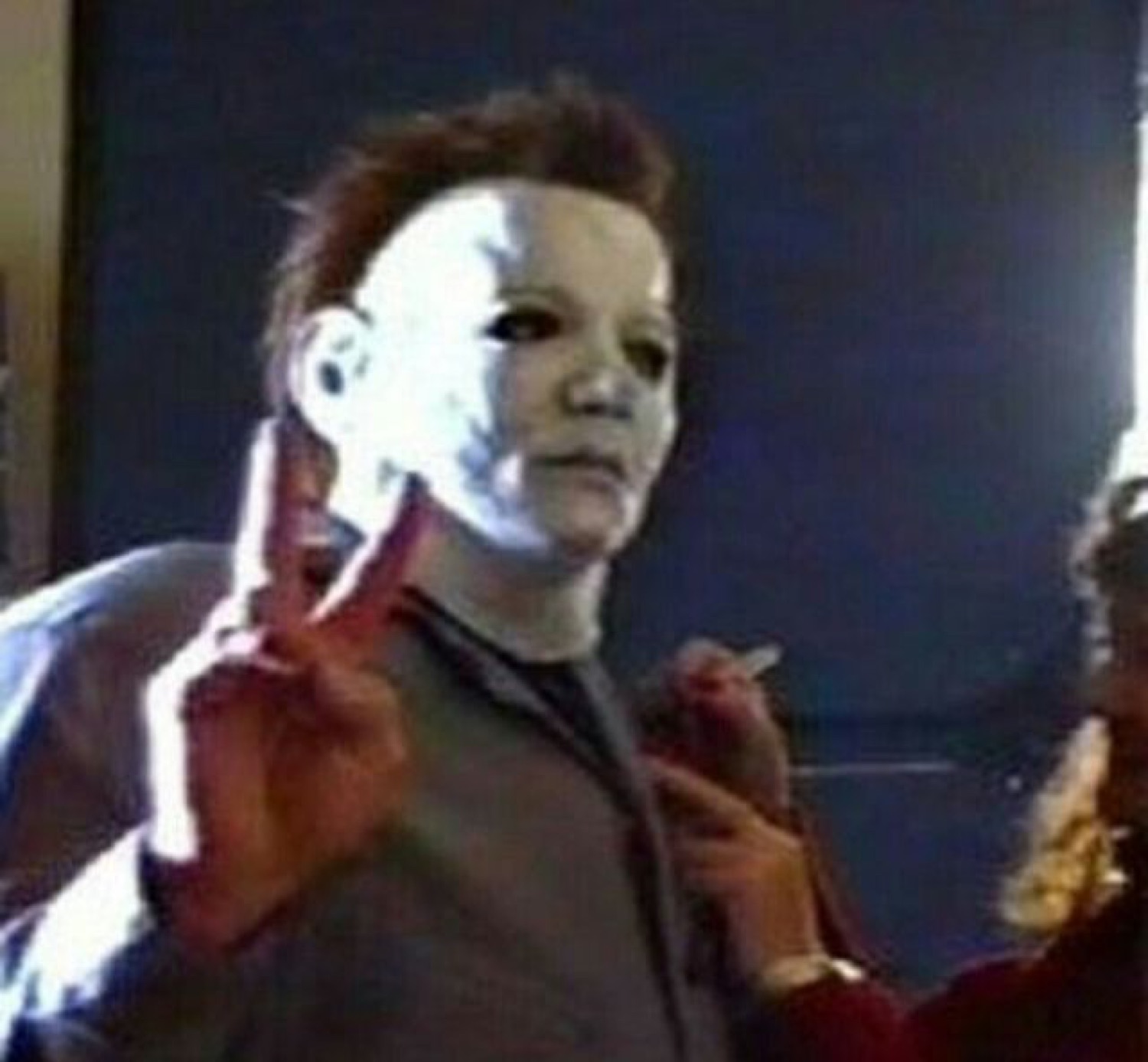 Michael Myers throwing a peace sign