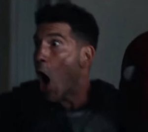 Man in dark tactical gear with his mouth wide open in shocked disbelief