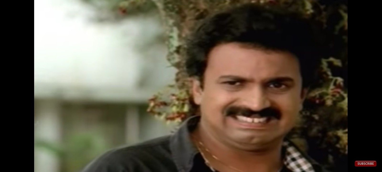 Salim Kumar with a cheesy grin