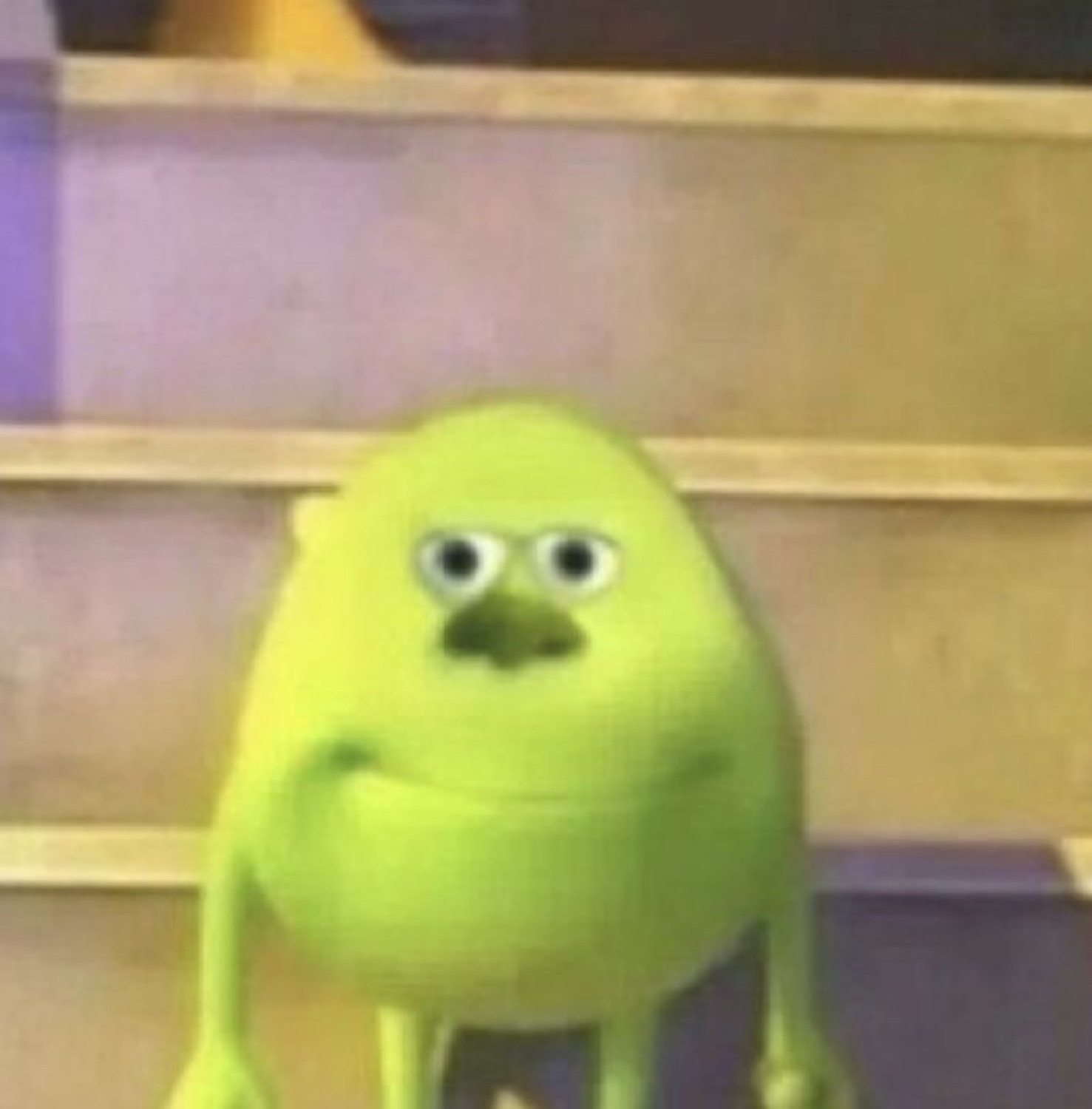 Mike Wazowski staring directly into your soul with a deeply unsettled expression