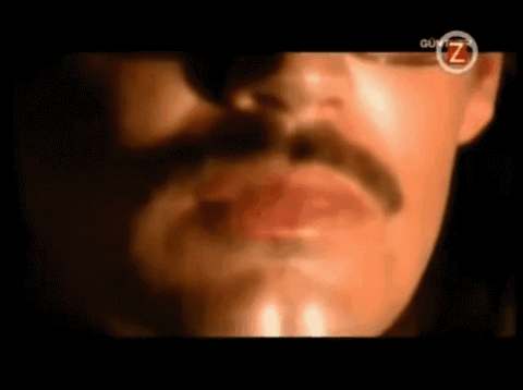 Mustached man singing dramatically, "Oooh, you touch my tra-la-laaa"