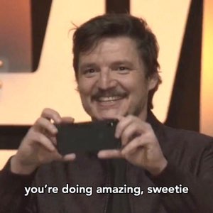 Pedro Pascal beaming and holding up his phone captioned 'you're doing amazing, sweetie'